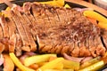 roast beef with seasonings and sliced Ã¢â¬â¹Ã¢â¬â¹barbecue salad served on plate on wooden table Royalty Free Stock Photo